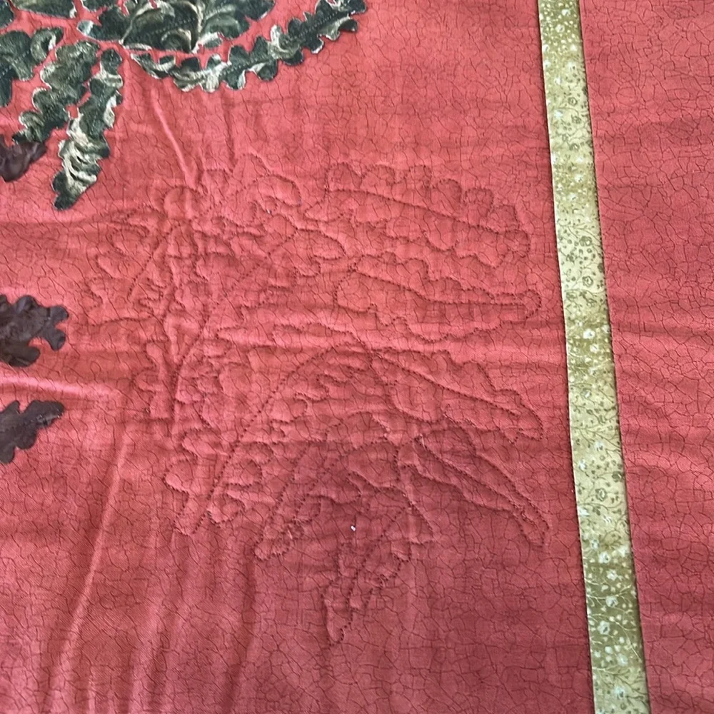 Beautiful terra cotta and green quilt wall hanging. Homemade.